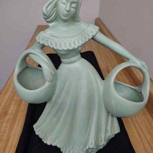 Haeger pottery lady with baskets, large, light green glaze.